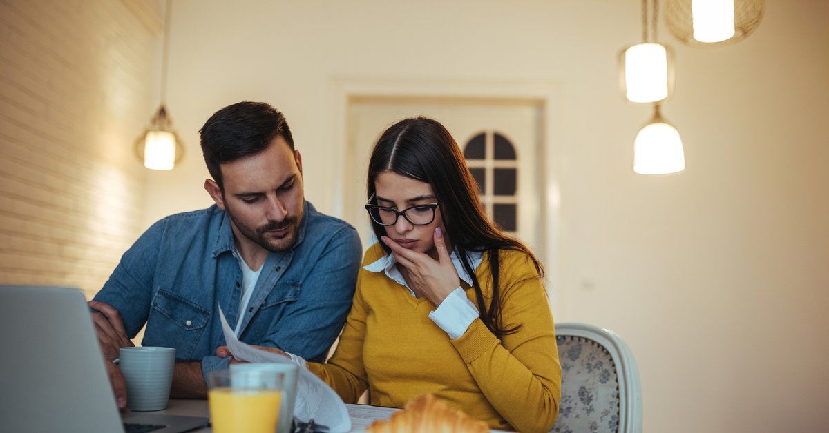 Man and woman looking at credit report
