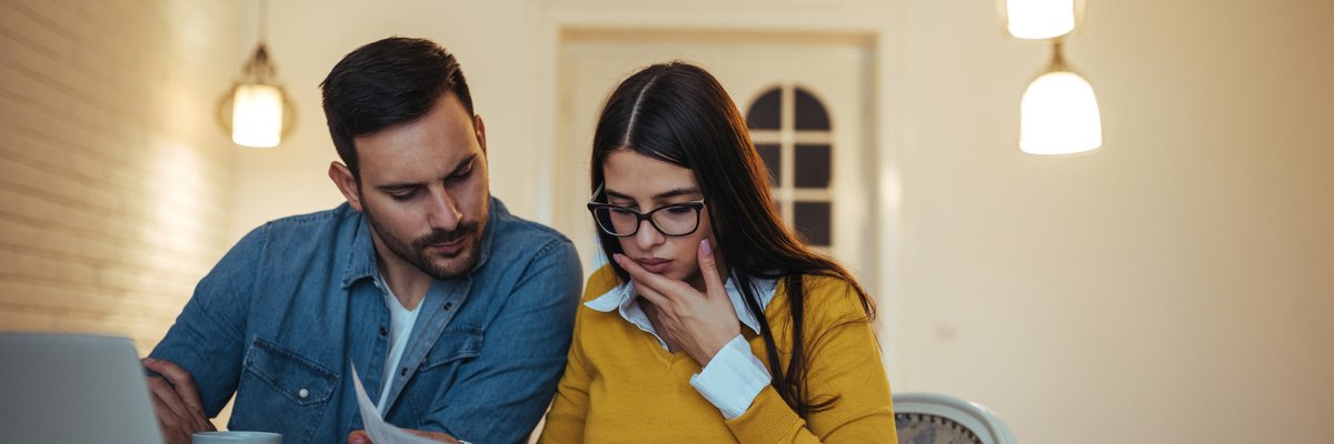 Man and woman looking at credit report