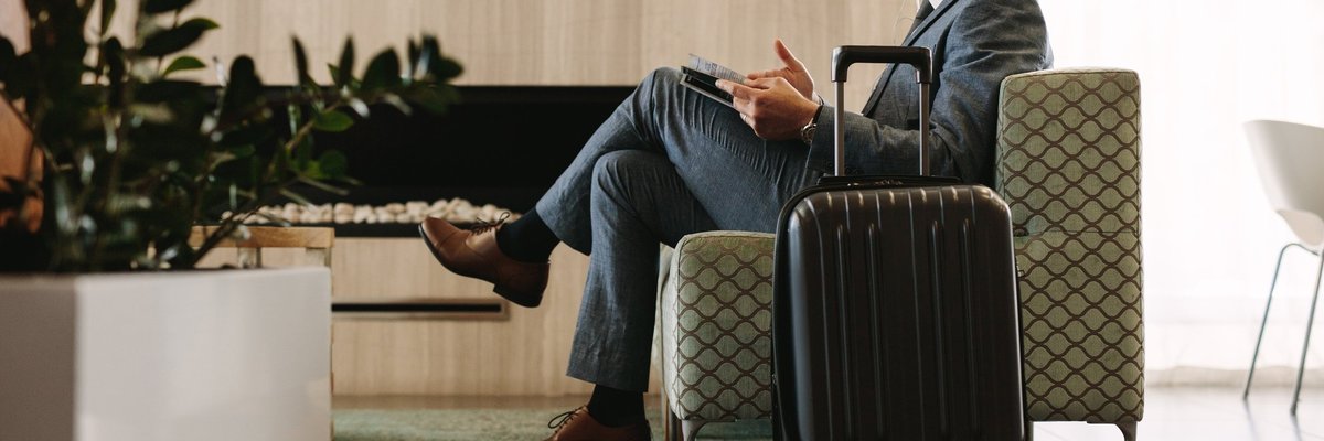 man relaxing in airport lounge