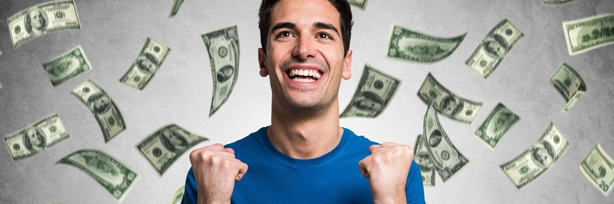 Money raining on smiling man