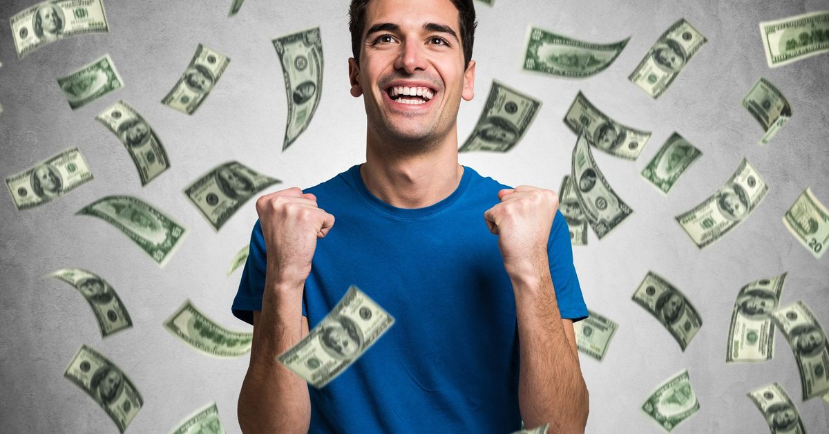 Money raining on smiling man