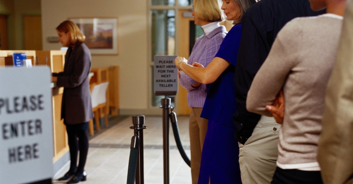 people waiting in line at a bank.