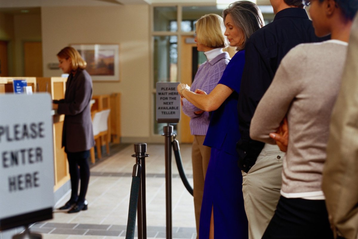 people waiting in line at a bank.