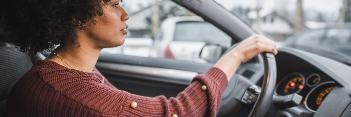 A person driving a car.