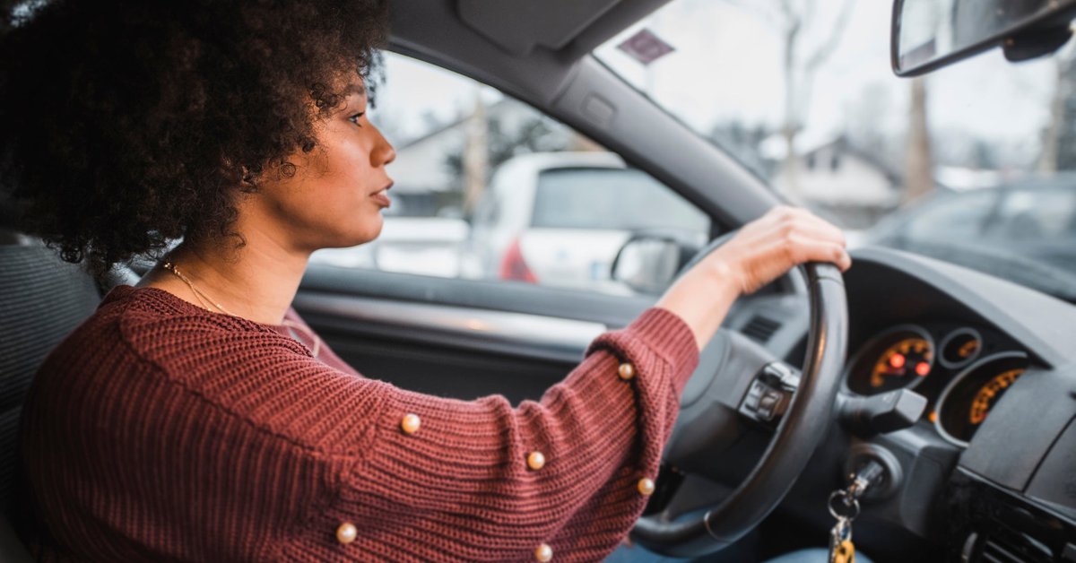 A person driving a car.