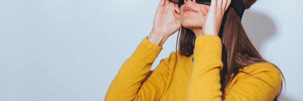 A person wearing virtual reality goggles.