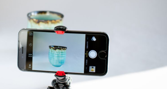 Image of a smartphone camera taking a picture of a vase.