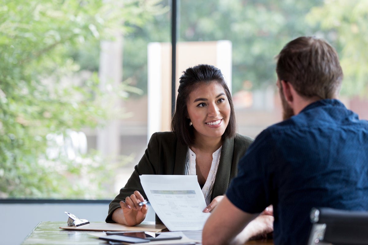 A man and women discussing a down payment.