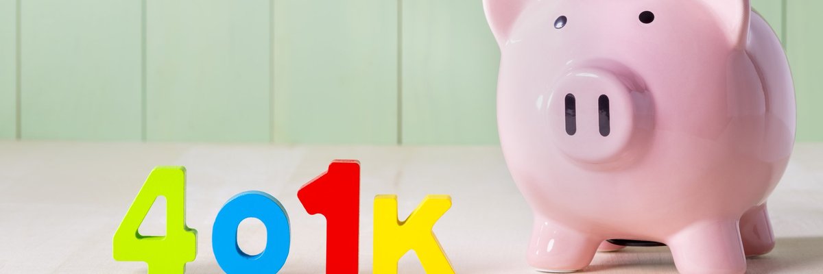 Colorful letters spelling out 401(k) next to a piggy bank.