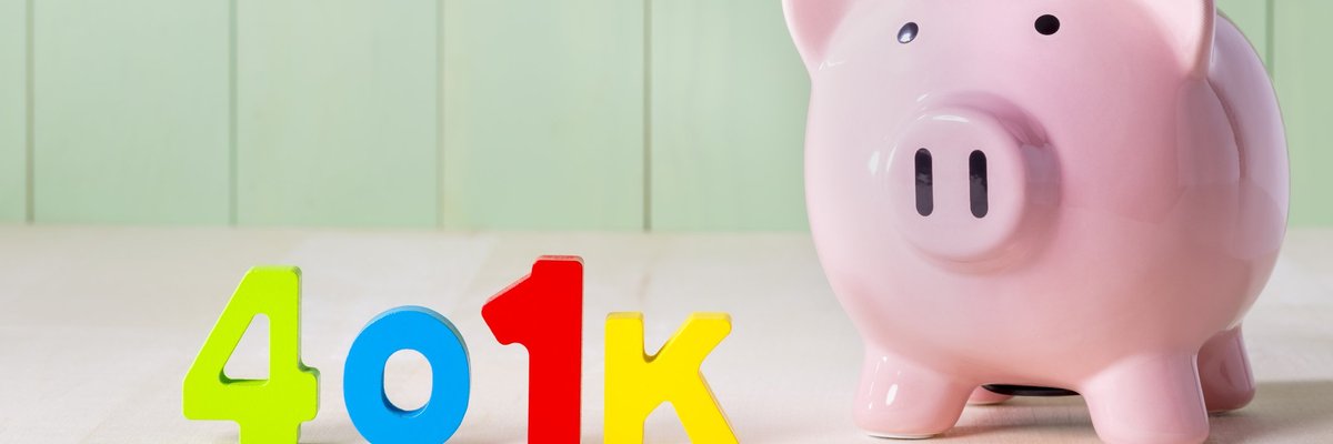 Colorful letters spell out the word 401k next to a piggy bank