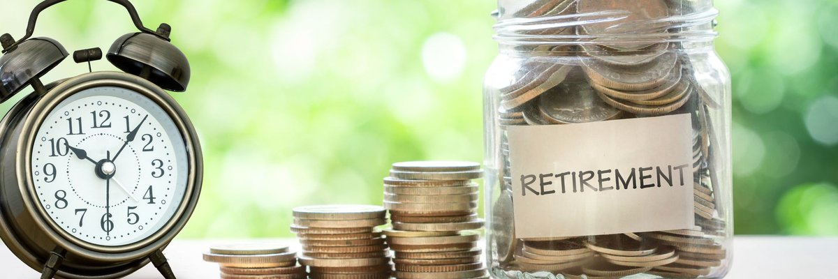A clock and a stack of coins next to a jar labeled retirement.