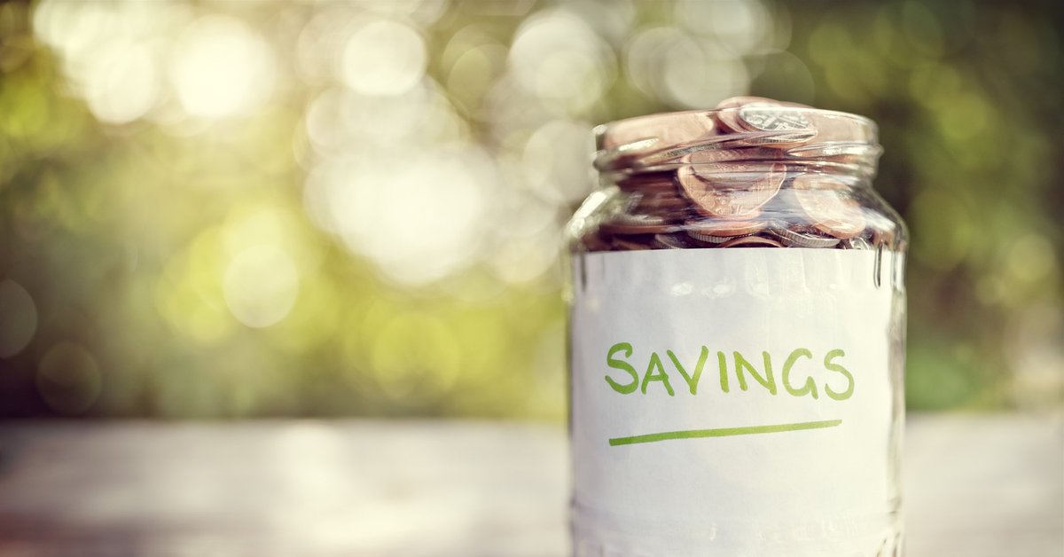 jar full of coins and labeled savings