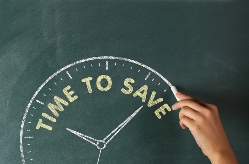 Clock drawn on chalkboard with the words time to save along the top