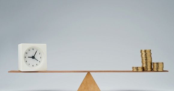 Balanced scale with clock on one side and coins on the other