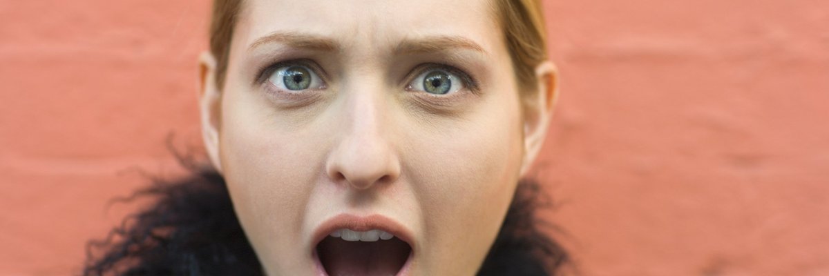 A woman with a shocked expression on her face.