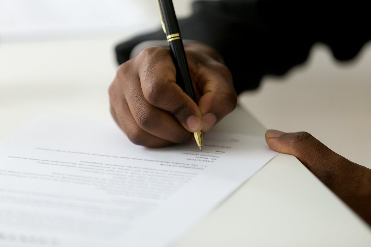 hand signing paperwork