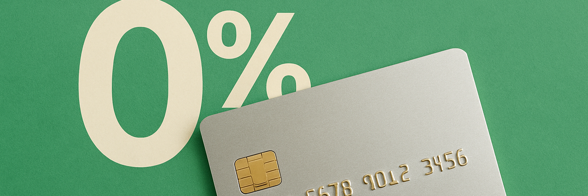 A silver 0 percent APR credit card against green background.