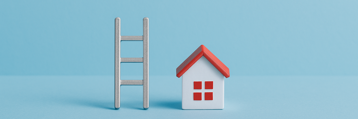 A small toy ladder and house centered on baby blue background.
