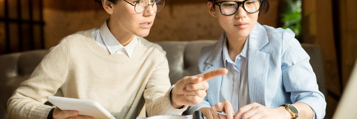 two women discussing the details of a personal loan