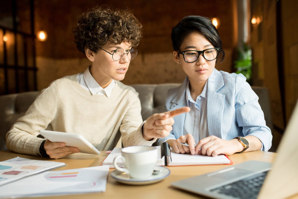 two women discussing the details of a personal loan