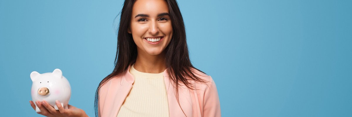 young woman holding piggy bank