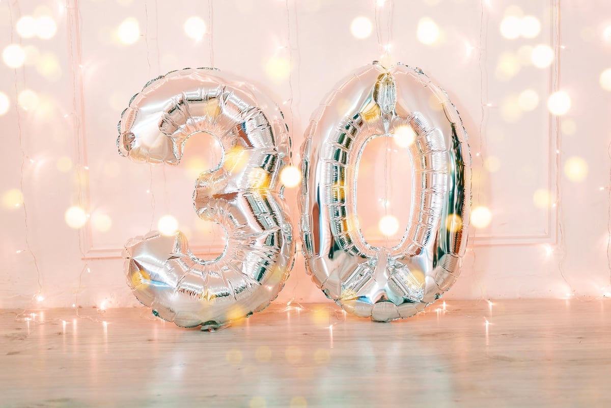 Silver balloons that say 30 and twinkle lights