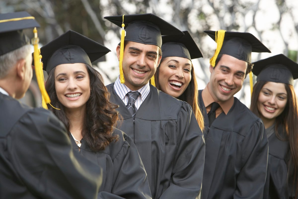 College graduates receiving diplomas