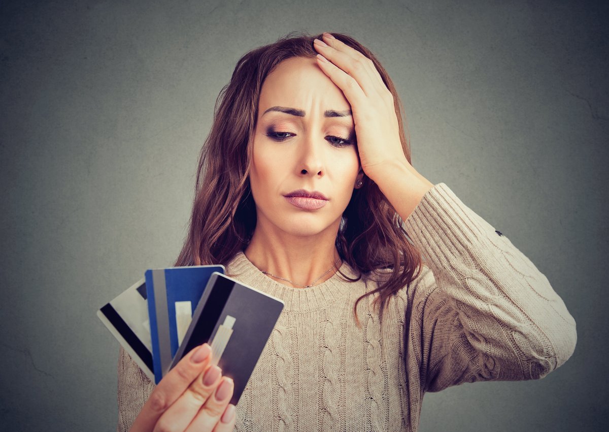 woman distressed by credit cards