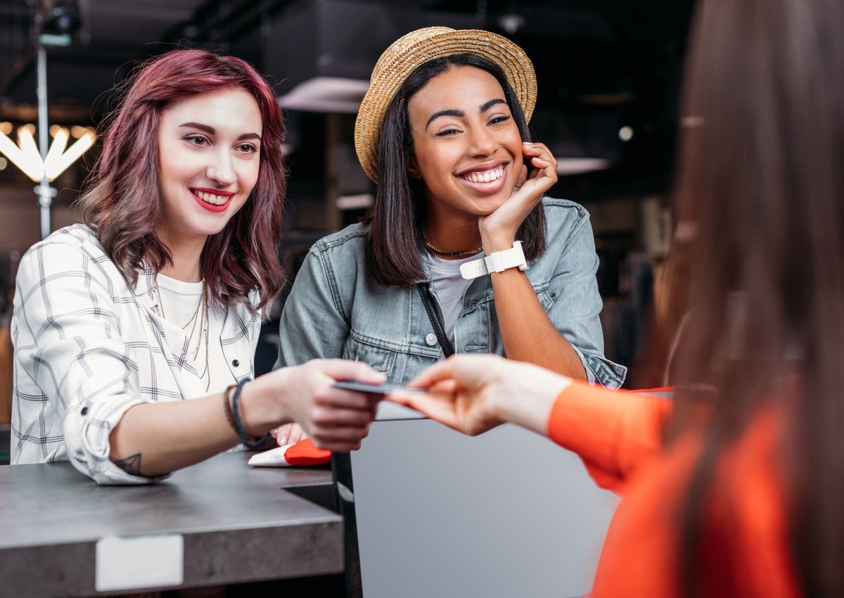 two millennials shopping with a credit card