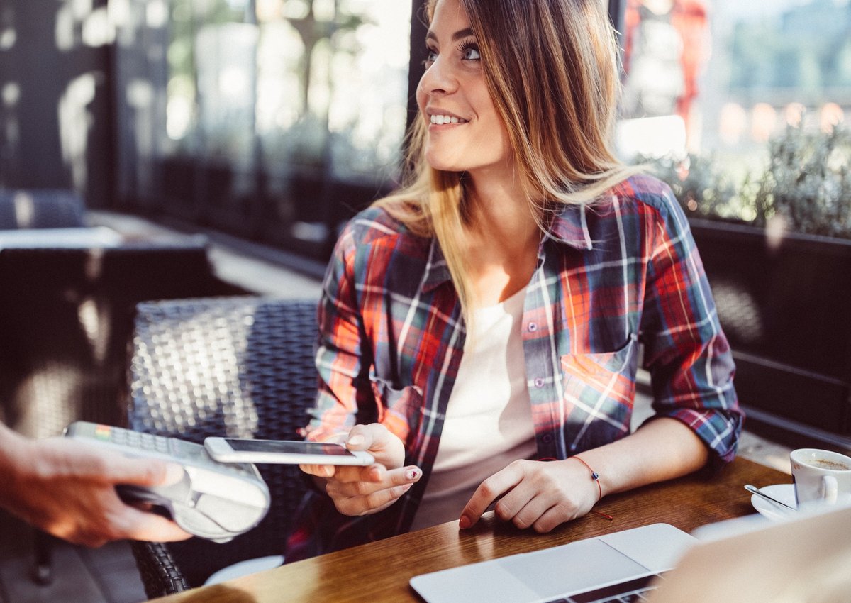 Customer paying in restaurant with mobile pay
