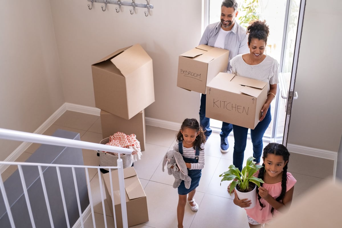 A young family move into their new home.