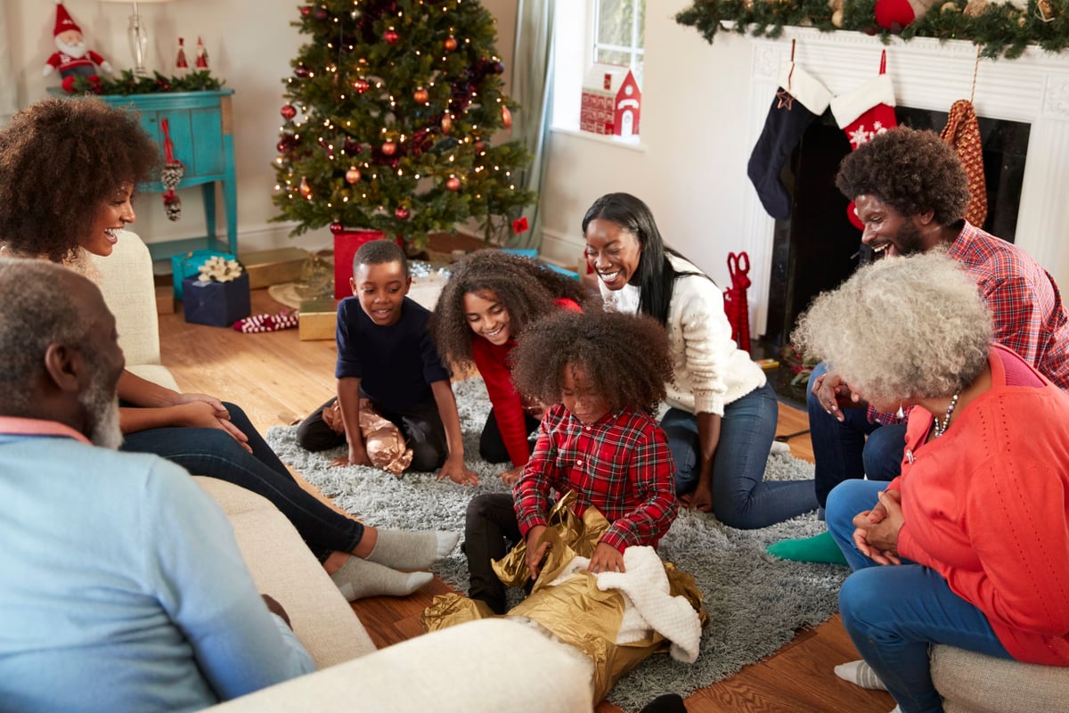 A family opening gifts on Christmas morning.