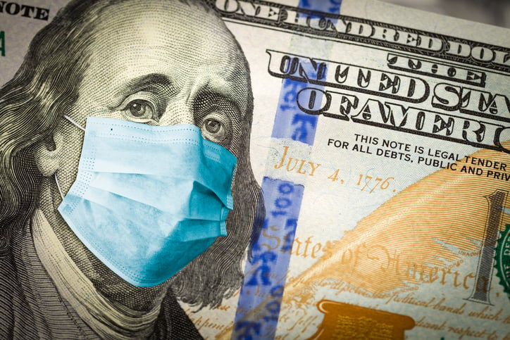 A 100-dollar bill with Ben Franklin wearing a medical mask