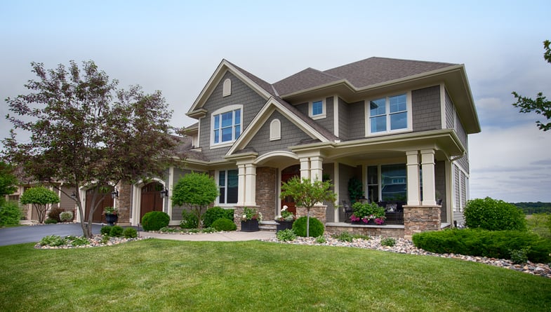 External view of a large, grey suburban house.