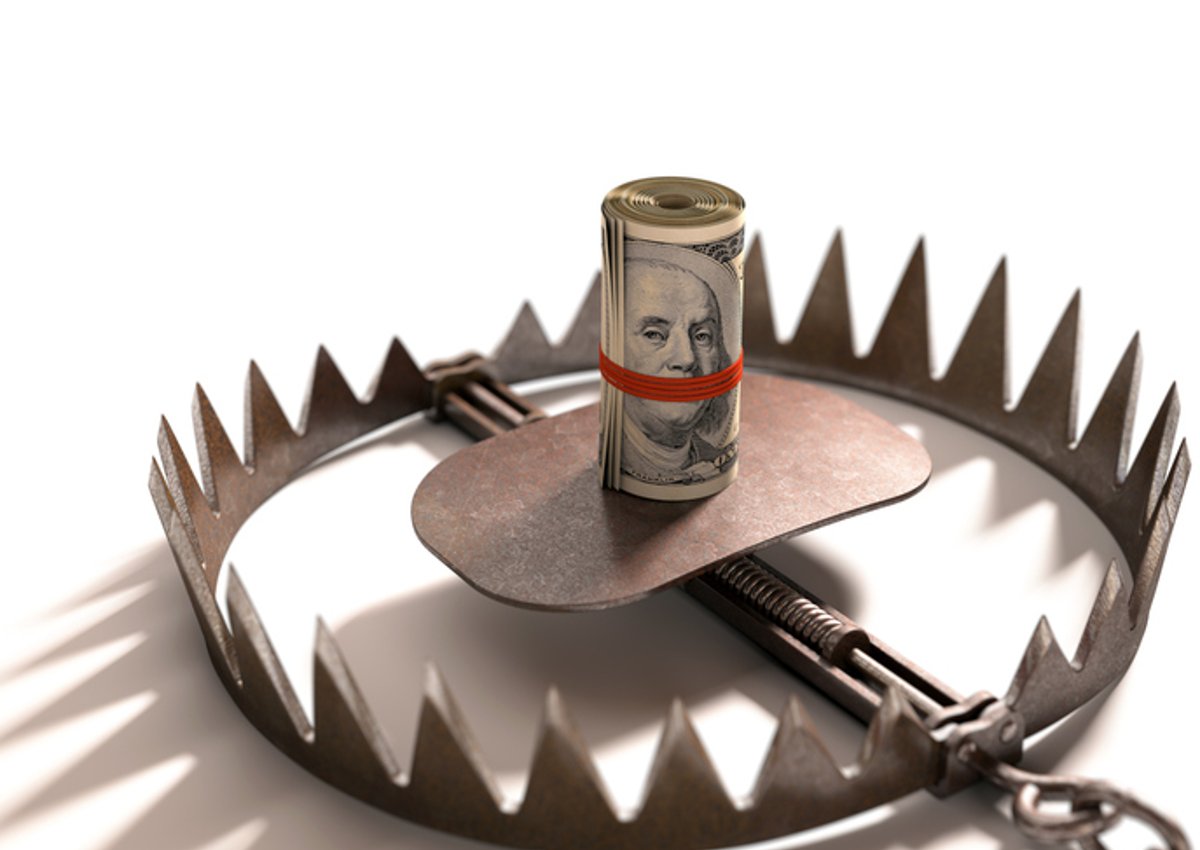 A roll of bills baits a trap.