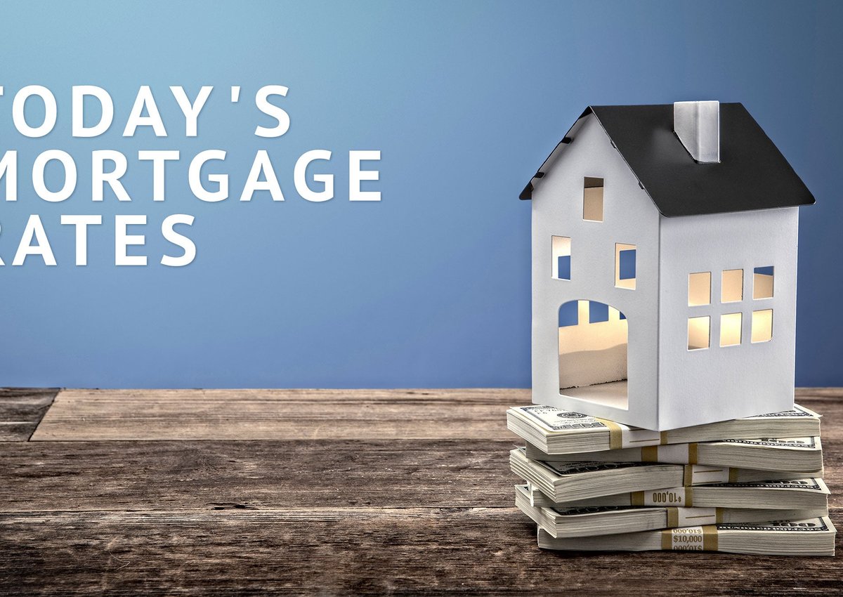 Hollow model home on top of stacks of cash with Today's Mortgage Rates graphic.