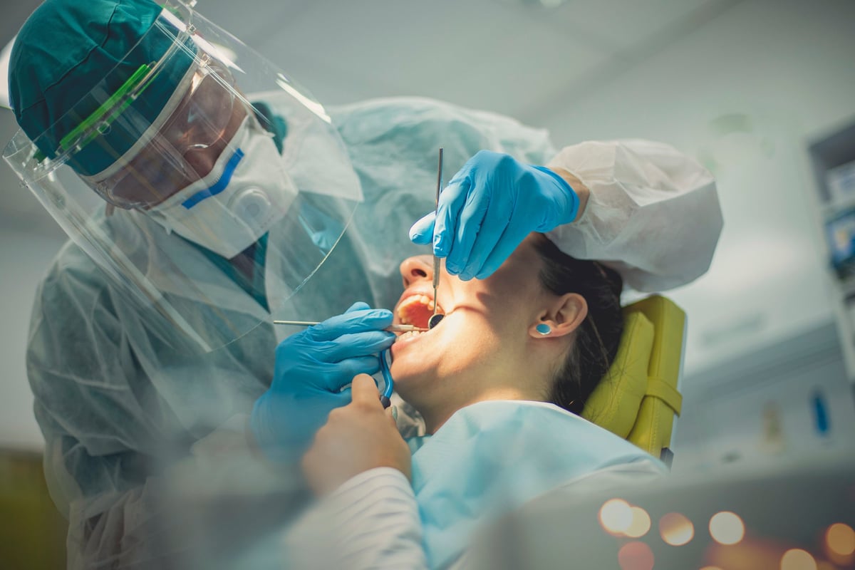 Person getting a dental procedure done.