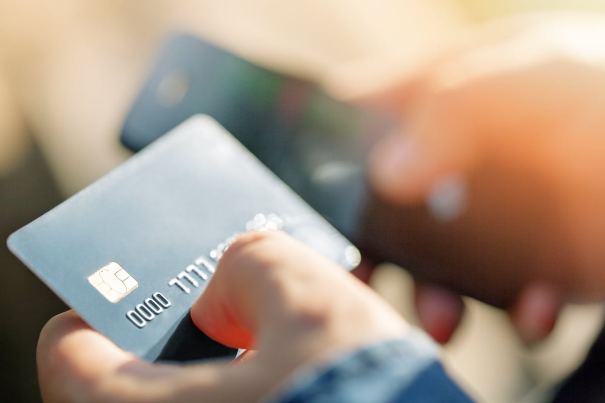 Person holding credit card