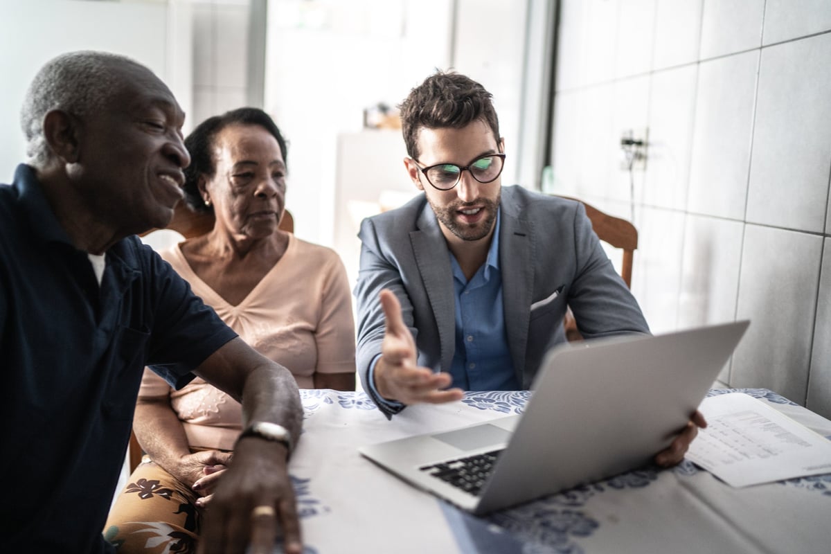 Senior couple meets with male professional.
