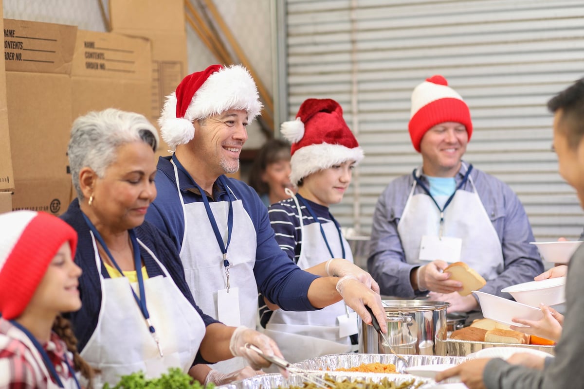 Volunteers in Santa Hats Helping Christmas Charity
