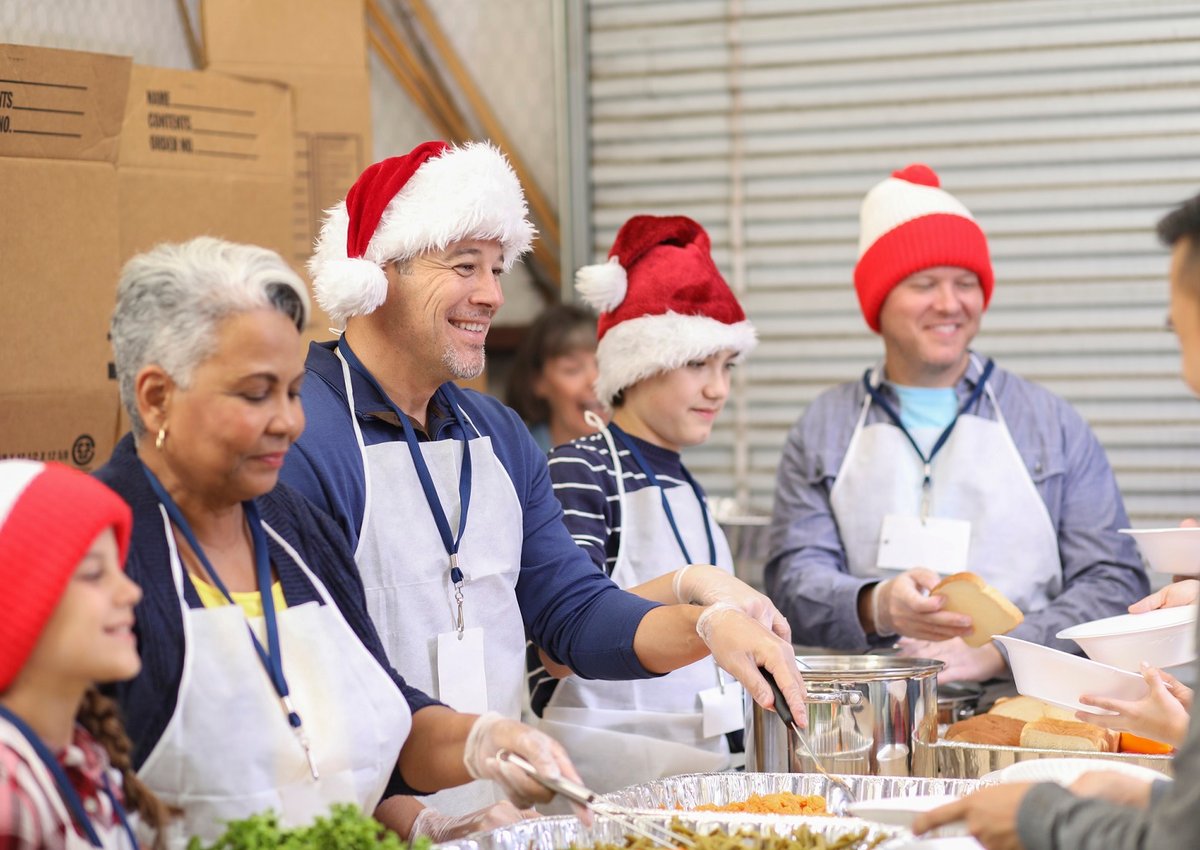 Volunteers in Santa Hats Helping Christmas Charity
