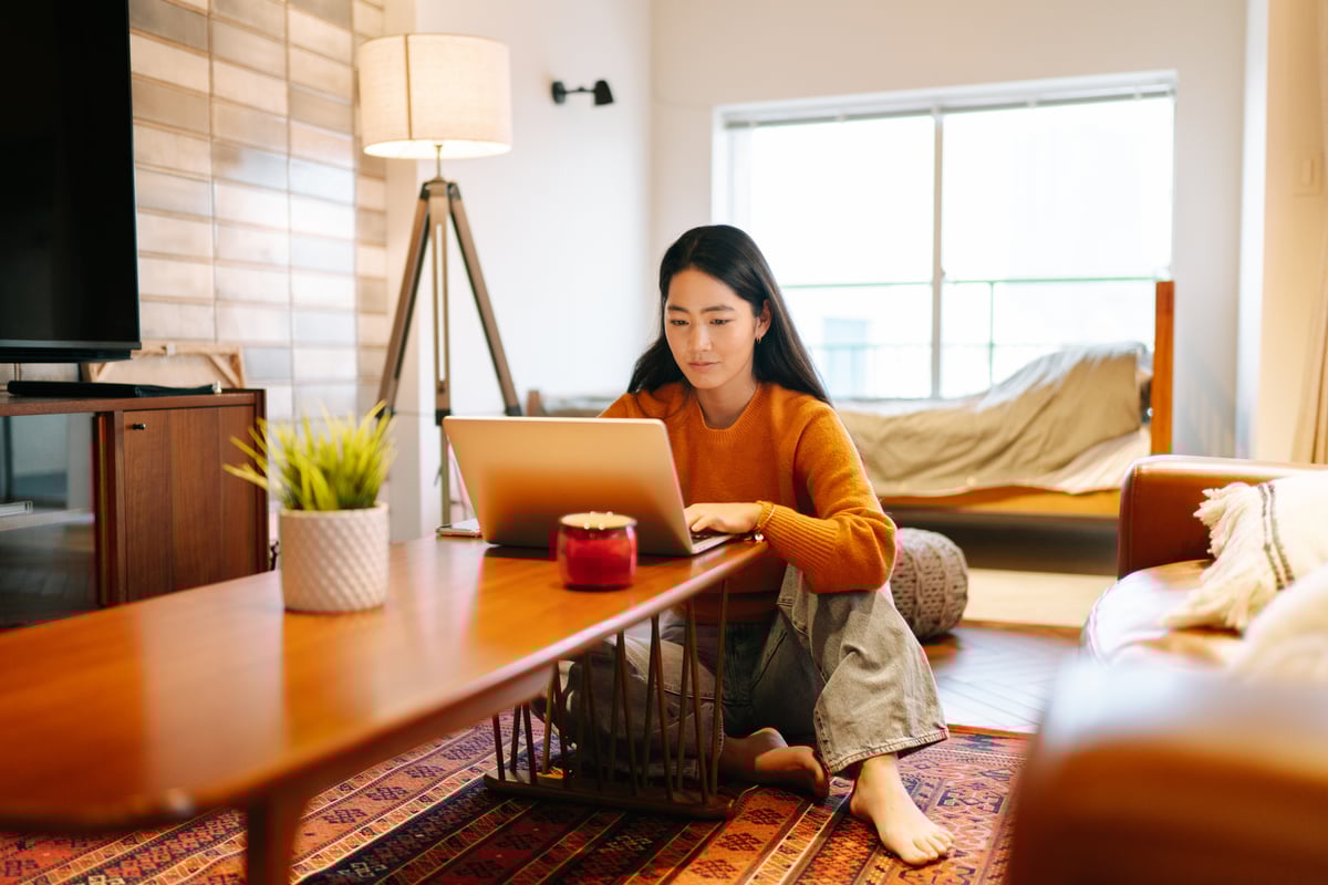 Woman Thinking At Laptop