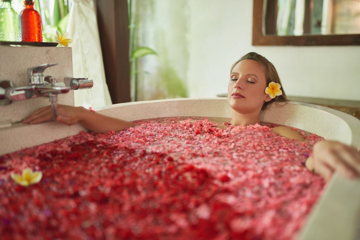 Woman relaxing in a soaking tub.