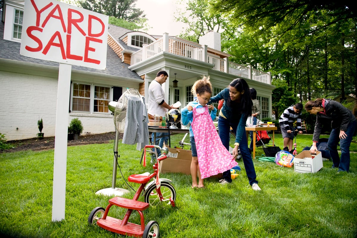 People browsing items at a yard sale.