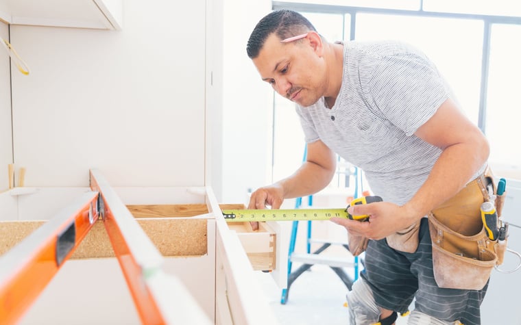 A contractor working on a kitchen renovation.