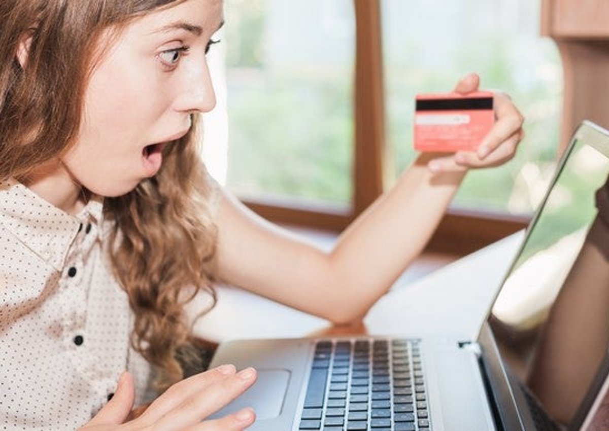 A woman checking out her credit score on her laptop.