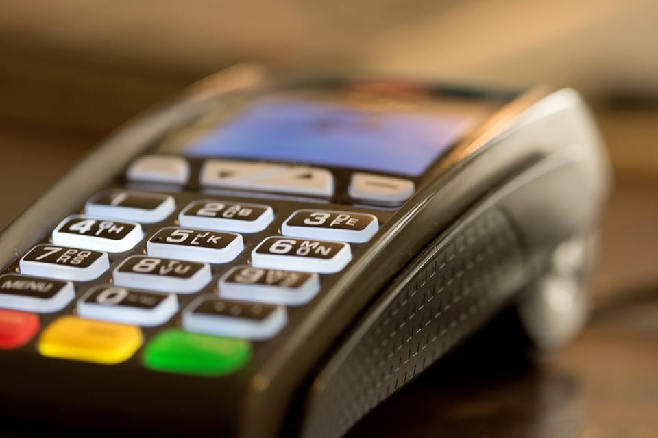 A credit card reader on a table.