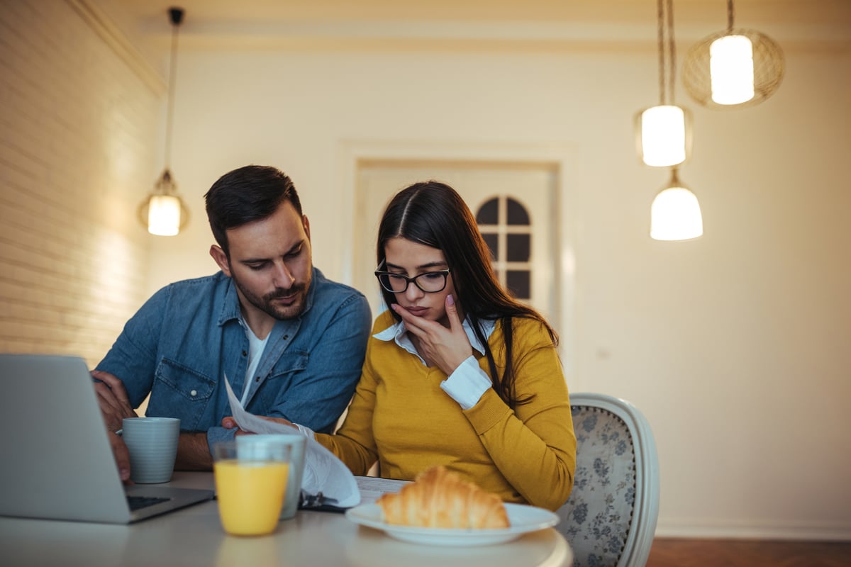 Man and woman looking at credit report
