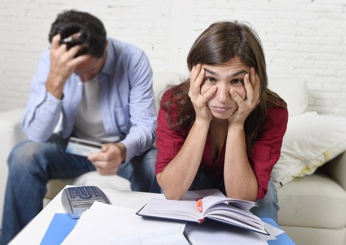 young couple worried about money