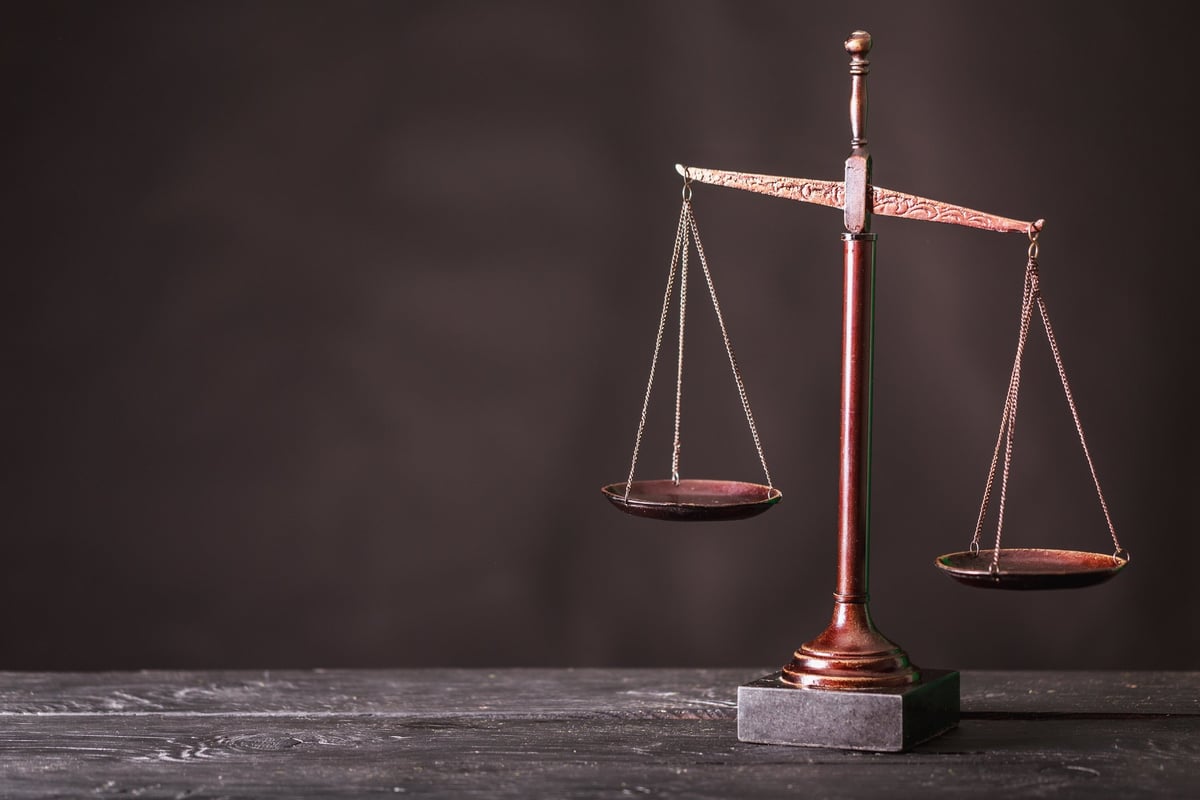 balance scales tipping to one side